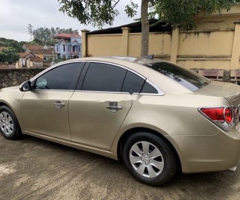 Chevrolet Cruze 2010 - Bán Chevrolet Cruze MT sản xuất 2010, màu vàng cát số sàn giá cạnh tranh