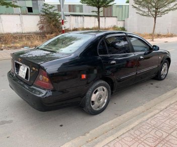 Daewoo Magnus 2004 - Cần bán Daewoo Magnus sản xuất 2004, màu đen, 139tr