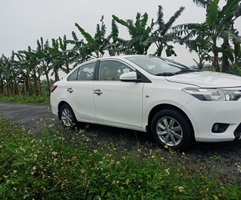 Toyota Vios 2014 - Gia đình cần bán Toyota Vios sản xuất 2014, màu trắng, mới đi được 10.000km
