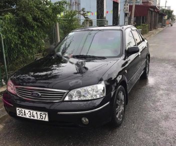 Ford Laser   2003 - Bán Ford Laser GHIA 1.8 MT sản xuất năm 2003, màu đen, 134 triệu