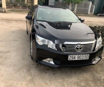 Toyota Camry  2.0E  2013 - Cần bán lại xe Toyota Camry 2.0E đời 2013, màu đen chính chủ, giá tốt