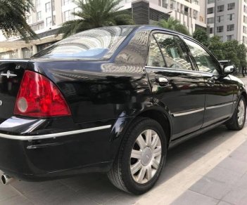 Ford Laser   Ghia AT   2006 - Bán ô tô Ford Laser Ghia AT năm sản xuất 2006, màu đen xe gia đình