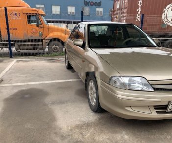 Ford Laser 2001 - Bán xe Ford Laser sản xuất năm 2001, màu vàng xe gia đình