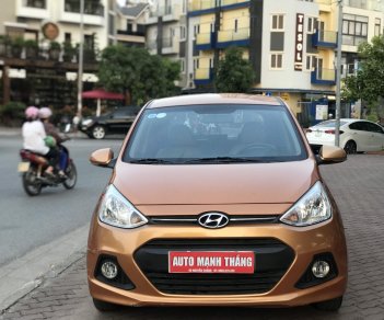 Hyundai Grand i10 1.0 AT 2014 - Cần bán xe Hyundai Grand i10 1.0 AT sản xuất 2014, màu nâu