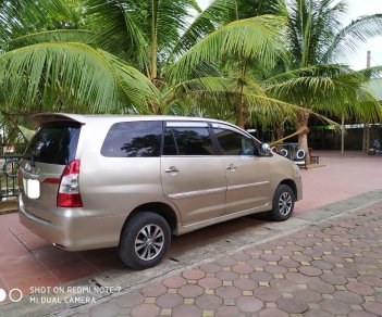 Toyota Innova 2.0E 2014 - Bán Toyota Innova 2.0E đời 2014, màu vàng, chính chủ, giá 385tr