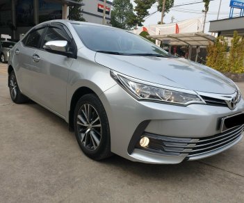 Toyota Corolla altis G 2018 - Cần bán xe Toyota Altis 1.8G AT 2018 màu bạc, xe đi ít giữ kĩ chính hãng Toyota Sure