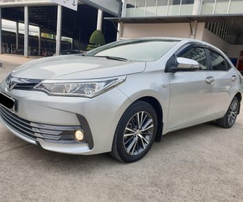 Toyota Corolla altis G 2018 - Cần bán xe Toyota Altis 1.8G AT 2018 màu bạc, xe đi ít giữ kĩ chính hãng Toyota Sure