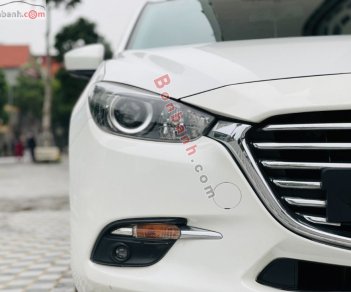 Mazda 3   1.5 AT 2018 - Cần bán lại xe Mazda 3 1.5 AT năm 2018, màu trắng, giá chỉ 599 triệu