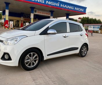 Hyundai Grand i10 2014 - Bán Hyundai Grand i10 năm sản xuất 2014, màu trắng, nhập khẩu nguyên chiếc còn mới, giá chỉ 305 triệu