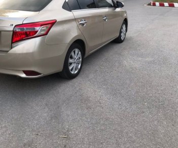 Toyota Vios   1.5 E  2015 - Cần bán Toyota Vios 1.5 E 2015, màu vàng