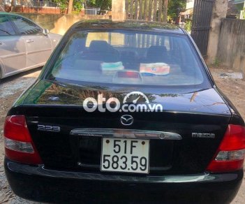 Mazda 323 2003 - Cần bán gấp Mazda 323 đời 2003, màu đen, nhập khẩu 