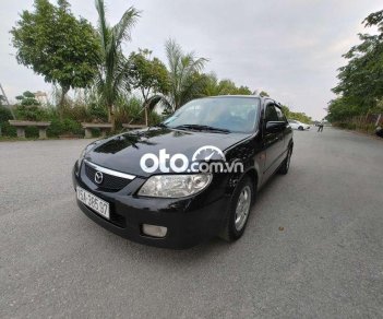 Mazda 323 2004 - Cần bán lại xe Mazda 323 sản xuất năm 2004, màu đen, giá 150tr