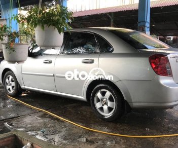 Chevrolet Lacetti MT 2011 - Bán xe Chevrolet Lacetti MT sản xuất năm 2011, màu bạc xe gia đình