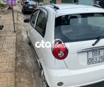 Chevrolet Spark MT 2009 - Cần bán gấp Chevrolet Spark MT sản xuất 2009, màu trắng còn mới giá cạnh tranh