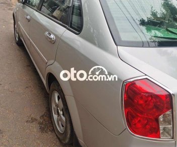 Daewoo Lacetti  MT 2010 - Bán ô tô Daewoo Lacetti MT năm 2010, màu bạc 