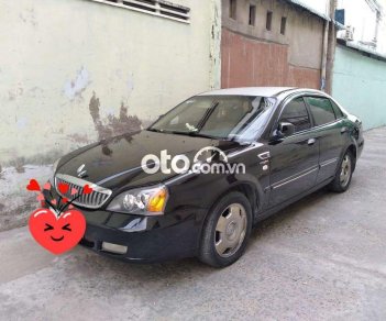 Daewoo Magnus 2004 - Cần bán lại xe Daewoo Magnus năm 2004, màu đen, giá 180tr