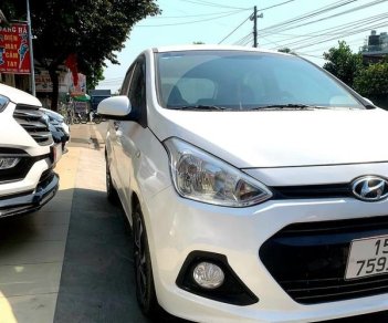 Hyundai Premio MT 2014 - Cần bán gấp Hyundai Grand i10 MT năm sản xuất 2014, màu trắng