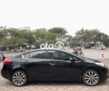 Kia K3 2.0AT 2014 - Cần bán lại xe Kia K3 2.0AT sản xuất năm 2014, màu đen, giá tốt