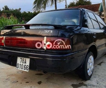 Mazda 323 MT 1994 - Cần bán xe Mazda 323 MT năm sản xuất 1994, màu đen, xe nhập, giá chỉ 39 triệu