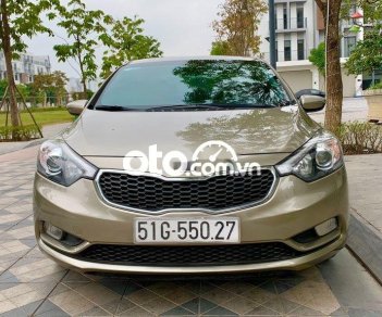 Kia K3  2.0AT 2015 - Bán Kia K3 2.0AT năm sản xuất 2015, màu vàng cát, giá bán 445 triệu