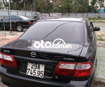 Mazda 626 MT 2001 - Cần bán lại xe Mazda 626 MT sản xuất năm 2001, màu đen