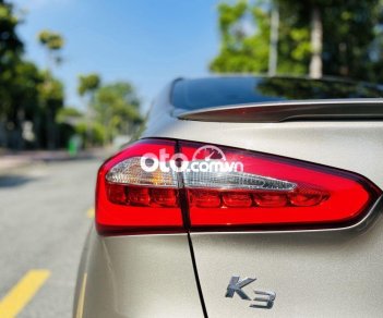 Kia K3 1.6MT 2014 - Bán Kia K3 1.6MT sản xuất năm 2014, màu vàng