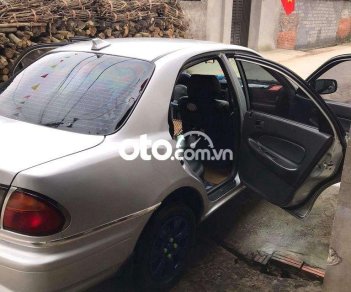 Mazda 323    MT 1997 - Bán Mazda 323 MT năm sản xuất 1997, màu bạc