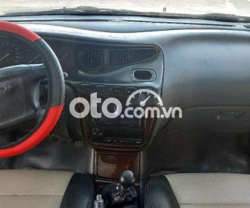 Daewoo Leganza 2002 - Cần bán gấp Daewoo Leganza sản xuất năm 2002, màu đen, xe nhập, 87tr