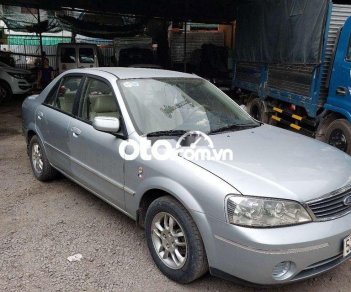 Ford Laser 2004 - Bán ô tô Ford Laser LXI năm 2004, màu bạc số sàn