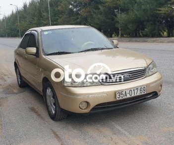 Ford Laser 2003 - Bán xe Ford Laser 1.8 năm 2003, màu vàng