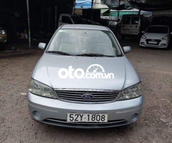 Ford Laser 2004 - Bán ô tô Ford Laser LXI năm 2004, màu bạc số sàn