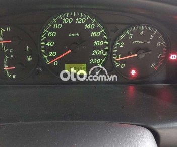 Ford Laser 2004 - Bán ô tô Ford Laser LXI năm 2004, màu bạc số sàn