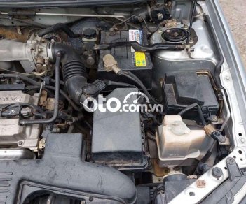 Ford Laser 2004 - Bán ô tô Ford Laser LXI năm 2004, màu bạc số sàn