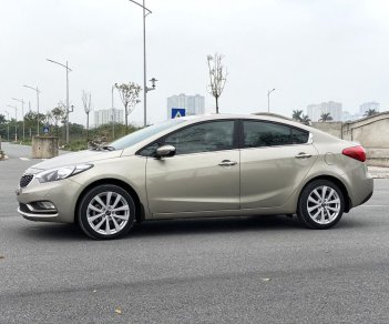 Kia K3 2014 - Cần bán gấp Kia K3 1.6AT sản xuất năm 2014, màu vàng cát, giá cạnh tranh