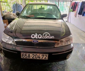 Ford Laser 2002 - Cần bán xe Ford Laser sản xuất 2002, màu đen xe gia đình, giá 110tr