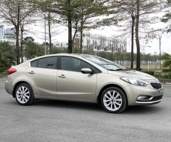 Kia K3 2014 - Cần bán gấp Kia K3 1.6AT sản xuất năm 2014, màu vàng cát, giá cạnh tranh