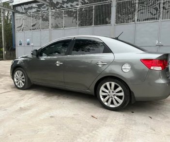 Kia Cerato 2009 - Bán Kia Cerato 1.6 số tự động sản xuất 2009, màu xám