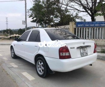 Mazda 323 2004 - Cần bán lại xe Mazda 323 sản xuất năm 2004, màu trắng