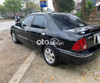 Ford Laser 2002 - Màu đen, giá 98tr