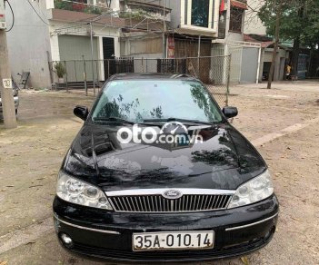 Ford Laser 2002 - Màu đen, giá 98tr