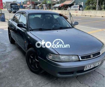 Mazda 626 1995 - Màu xám giá cạnh tranh