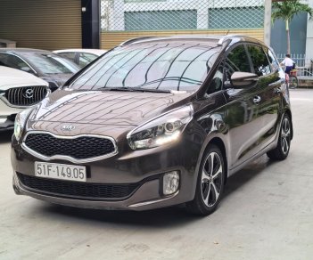 Kia Rondo 2015 - Số tự động, màu nâu, odo 77000km, biển TPHCM. Tặng 100% lệ phí trước bạ