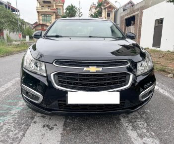 Chevrolet Cruze 2016 - Cần bán xe số sàn, màu đen còn mới ken